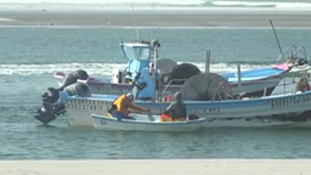 LA BOCANA BCS MEXICO-2022: Fishermen in Small Boats Near the Shore
