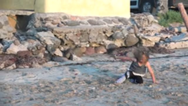 SAN CARLOS BCS MEXICO-2022: Child Playing in the Sand on the Beach