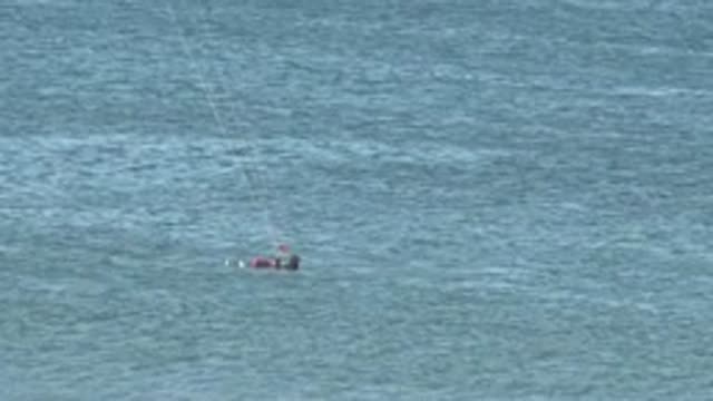 SAN JUANICO BCS MEXICO-2022: Kite Surfer Preparing and Riding in the Ocean