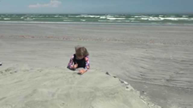 LA BOCANA BCS MEXICO-2022: Child Building Sandcastle on Sandy Beach