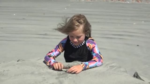 LA BOCANA BCS MEXICO-2022: Child Playing in the Sand on the Beach
