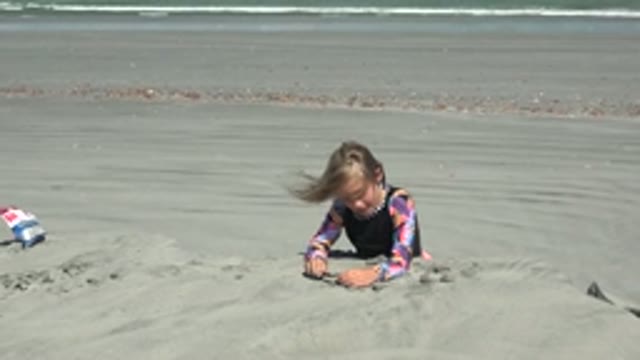 LA BOCANA BCS MEXICO-2022: Little Girl Burying Herself in Beach Sand