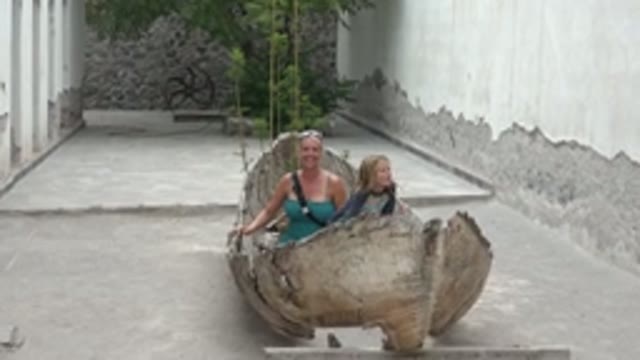 MULEGE BCS MEXICO-2022: Adult and Child Interacting in a Large Wooden Bowl