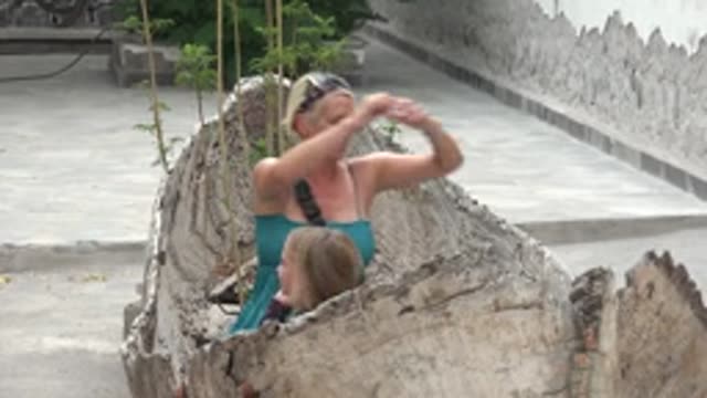 MULEGE BCS MEXICO-2022: Woman and Child Playing in Hollow Log Structure