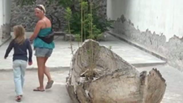 MULEGE BCS MEXICO-2022: Woman and Child Walking Through a Stone Courtyard