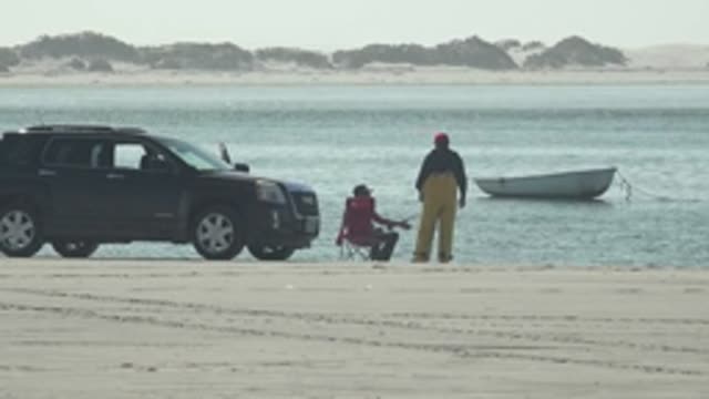 LA BOCANA BCS MEXICO-2022: Beach Scene with SUV, People, and Small Boat