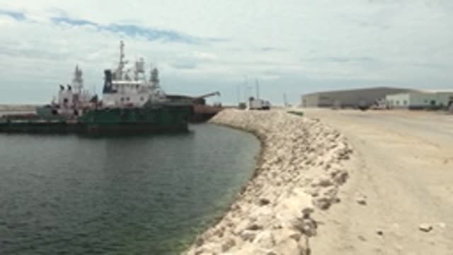 GUERRERO NEGRO BCS MEXICO-2022: Tugboat Moving Along Rocky Breakwater
