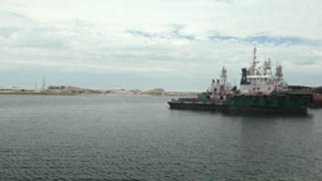 GUERRERO NEGRO BCS MEXICO-2022: Tugboat Moving in Calm Water Near Shore