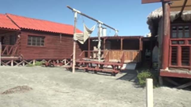 LA BOCANA BCS MEXICO-2022: Person Moving Ramp and Exiting Beach Cabin