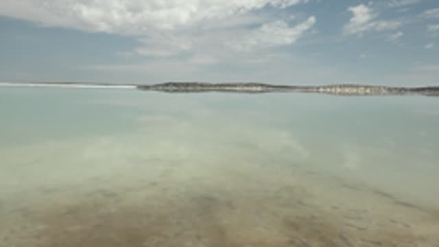 GUERRERO NEGRO BCS MEXICO-2022: Calm Water Reflecting Sky and Distant Shore