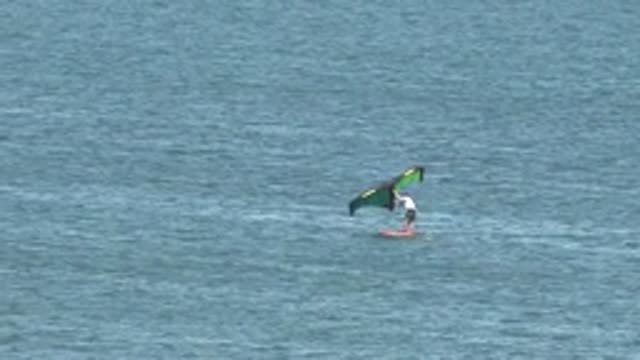 SAN JUANICO BCS MEXICO-2022: Kite Surfer Gliding on Calm Ocean Waters