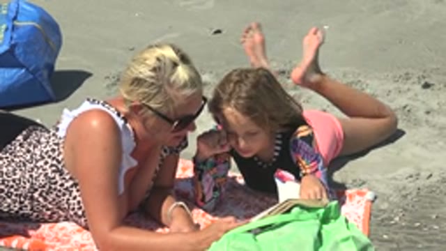 LA BOCANA BCS MEXICO-2022: Woman and Child Reading a Book on the Beach