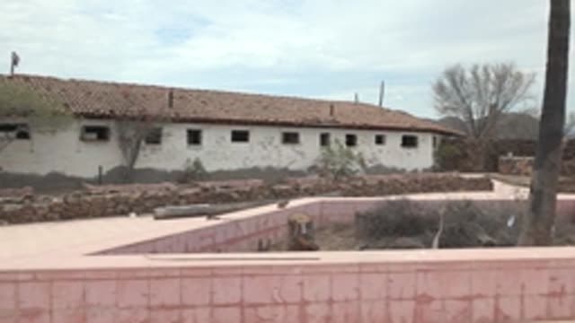 MULEGE BCS MEXICO-2022: Person Working on Tiled Roof of White Building