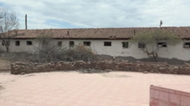 MULEGE BCS MEXICO-2022: Panning View of White Building and Arid Courtyard
