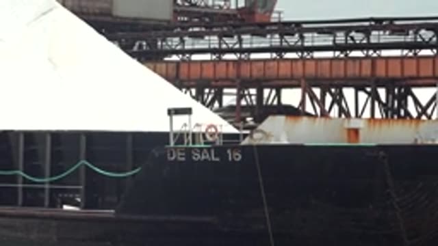 GUERRERO NEGRO BCS MEXICO-2022: Barge Loaded with White Cargo at Industrial Port