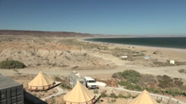 SAN JUANICO BCS MEXICO-2022: Panning View of Coastal Campsite with Tents