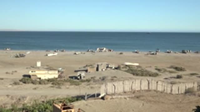 SAN JUANICO BCS MEXICO-2022: Abandoned Boats on Sandy Shore by Ocean