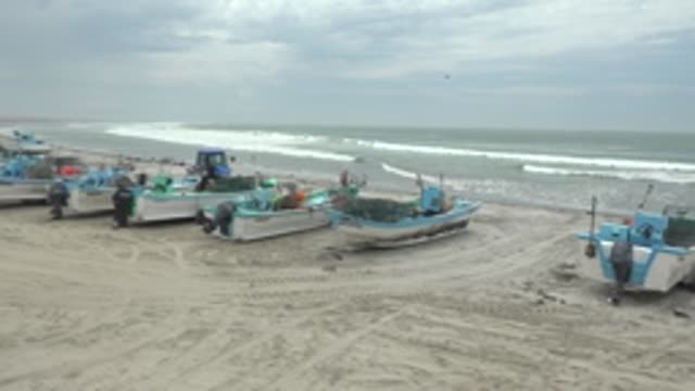 PUENTA ABREOJOS BCS MEXICO-2022: Fishing Boats on Sandy Beach with Ocean Waves