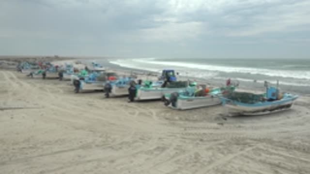 PUENTA ABREOJOS BCS MEXICO-2022: Fishing Boats on Sandy Shore with Ocean Waves