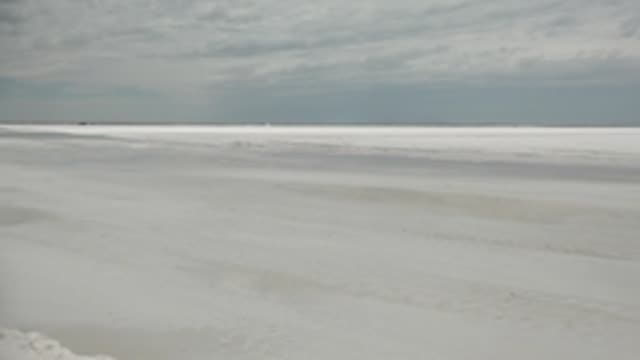 GUERRERO NEGRO BCS MEXICO-2022: Vast Frozen Ice Expanse Under Cloudy Sky