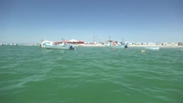 LA BOCANA BCS MEXICO-2022: Calm Ocean Waters with Boats near the Beach