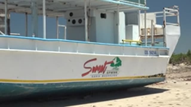 SAN CARLOS BCS MEXICO-2022: Boat with 'Sunset Cruise' Text Zooming In