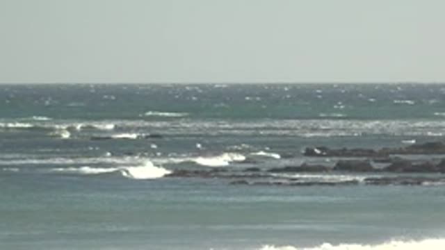 LA BOCANA BCS MEXICO-2022: Waves Crashing Against Rocky Shoreline