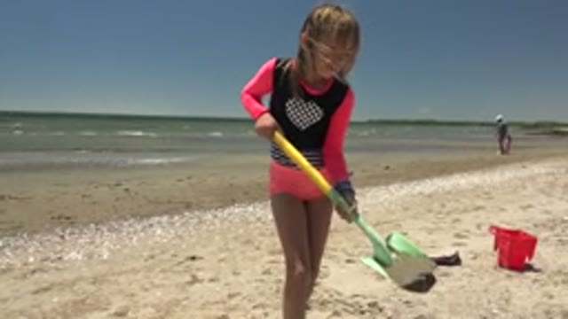 SAN CARLOS BCS MEXICO-2022: Child Digging in Sand with Shovel on Beach