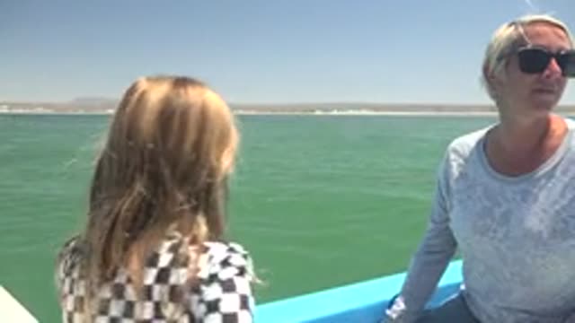 LA BOCANA BCS MEXICO-2022: A Girl and Woman Interact on a Boat