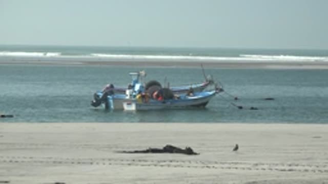 LA BOCANA BCS MEXICO-2022: Fishing Boat Drifting Near Sandy Shore