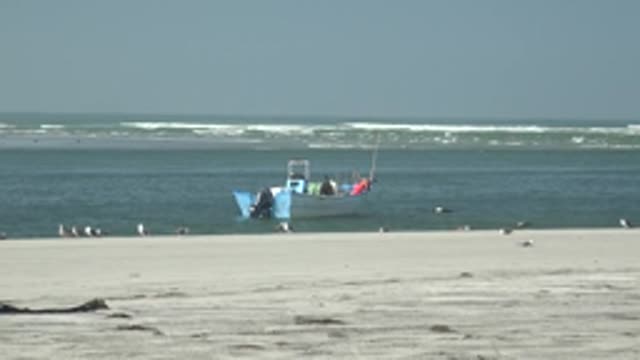 LA BOCANA BCS MEXICO-2022: Fishing Boat and Seagulls on Sandy Beach
