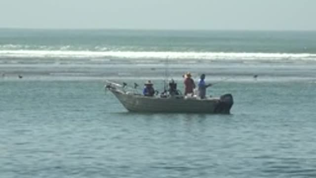 LA BOCANA BCS MEXICO-2022: People Fishing From a Small Boat in the Ocean