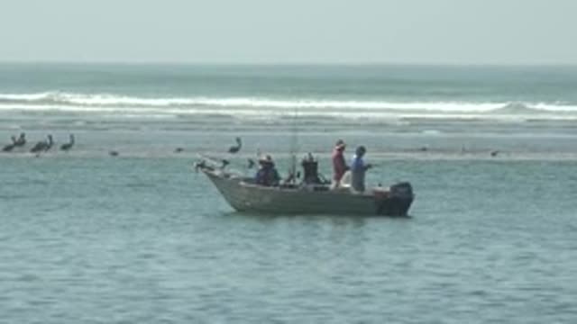 LA BOCANA BCS MEXICO-2022: Anglers Fishing From Small Boat near Shore