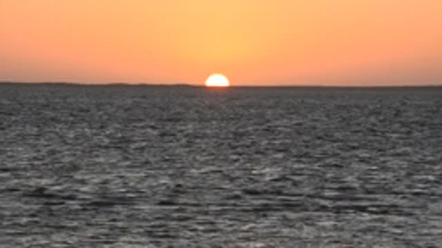 SAN CARLOS BCS MEXICO-2022: Sunset over Calm Ocean Waters