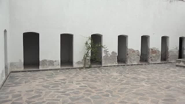 MULEGE BCS MEXICO-2022: Panning View of Stone Courtyard with Arched Wall Openings