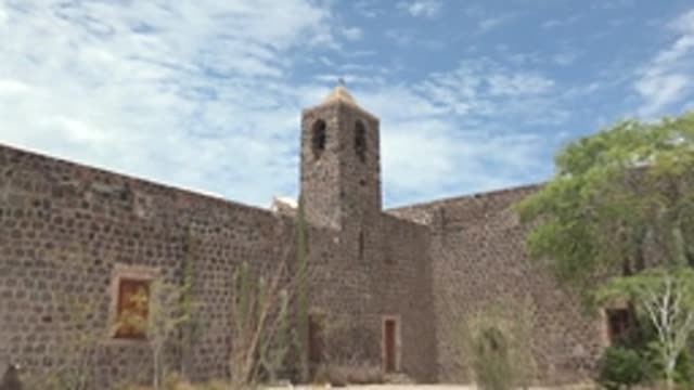 MULEGE BCS MEXICO-2022: Stone Mission Courtyard with Bell Tower and Cacti