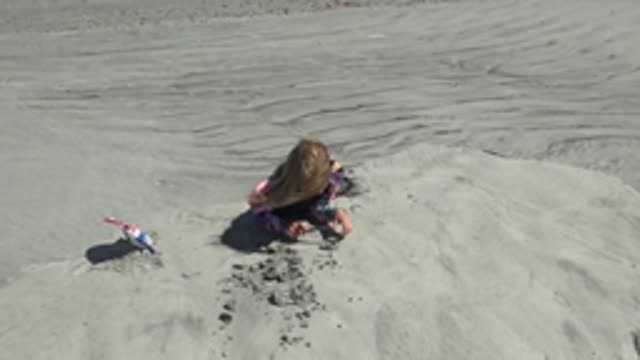 LA BOCANA BCS MEXICO-2022: Little Girl Digging in the Sand at the Beach
