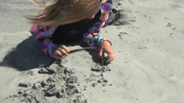 LA BOCANA BCS MEXICO-2022: Child Building Sandcastles in the Sand