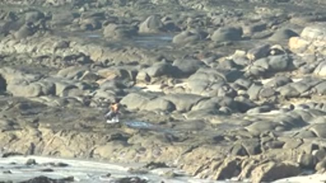 LA BOCANA BCS MEXICO-2022: Person Walking on Rocky Coastal Terrain