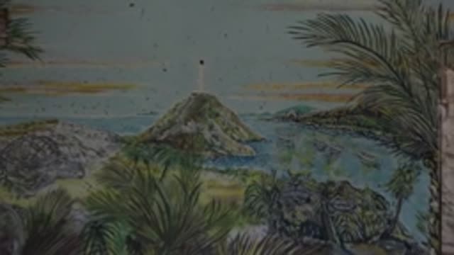 MULEGE BCS MEXICO-2022: Lighthouse Beacon Flashing Amid Swaying Palm Fronds