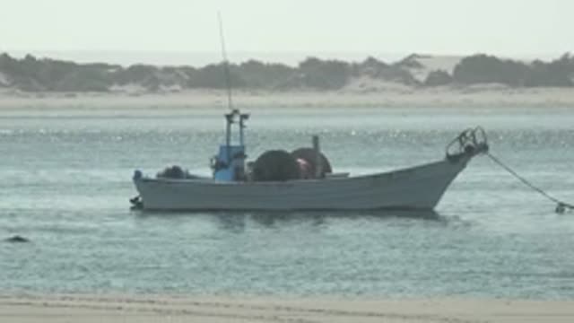 LA BOCANA BCS MEXICO-2022: Small Fishing Boat Anchored near Sandy Shore