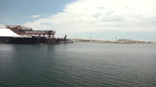 GUERRERO NEGRO BCS MEXICO-2022: Industrial Dock and Calm Water Under Shifting Clouds