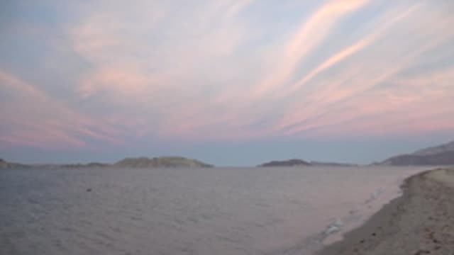 BAHIA DE LOS ANGELES BCS MEXICO-2022: Gentle Waves Lapping a Sandy Beach at Twilight
