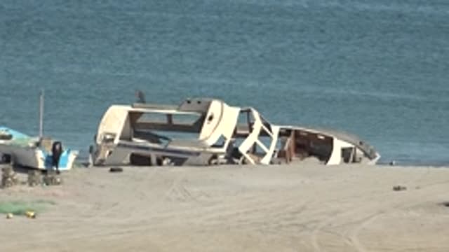 SAN JUANICO BCS MEXICO-2022: Beached Boat and Birds on Sandy Shore