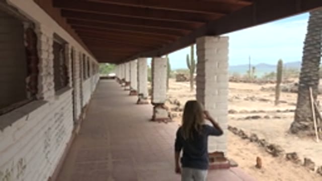 MULEGE BCS MEXICO-2022: Girl Walking on Desert Building's Covered Walkway