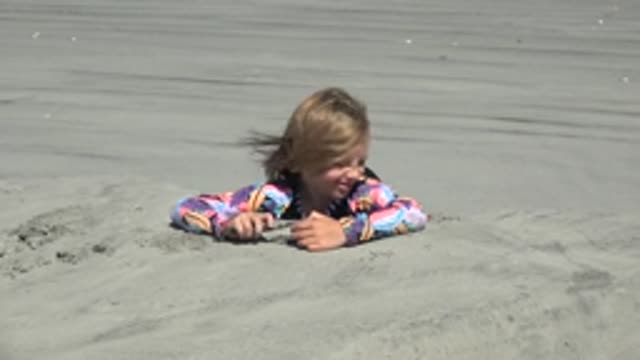LA BOCANA BCS MEXICO-2022: Child Playing with Sand on the Beach