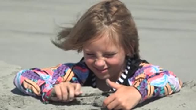 LA BOCANA BCS MEXICO-2022: Child Playing with Sand on the Beach
