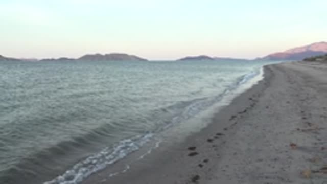 BAHIA DE LOS ANGELES BCS MEXICO-2022: Gentle Ocean Waves Lapping at Sandy Shore