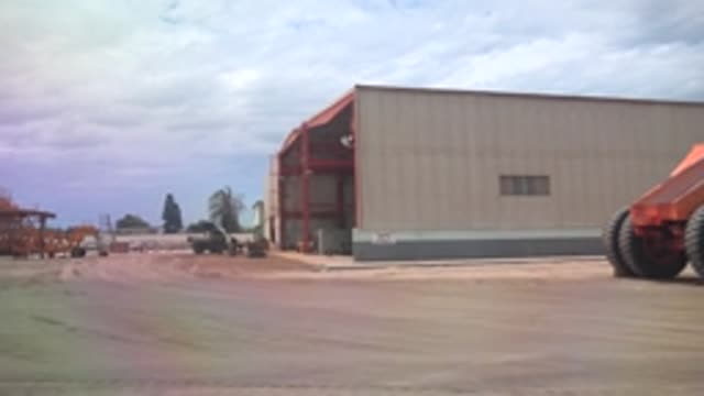 GUERRERO NEGRO BCS MEXICO-2022: Moving View of Industrial Yard with Warehouse and Machinery