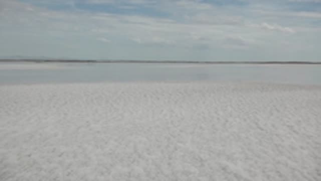 GUERRERO NEGRO BCS MEXICO-2022: Vast White Salt Flat with Moving Shadow